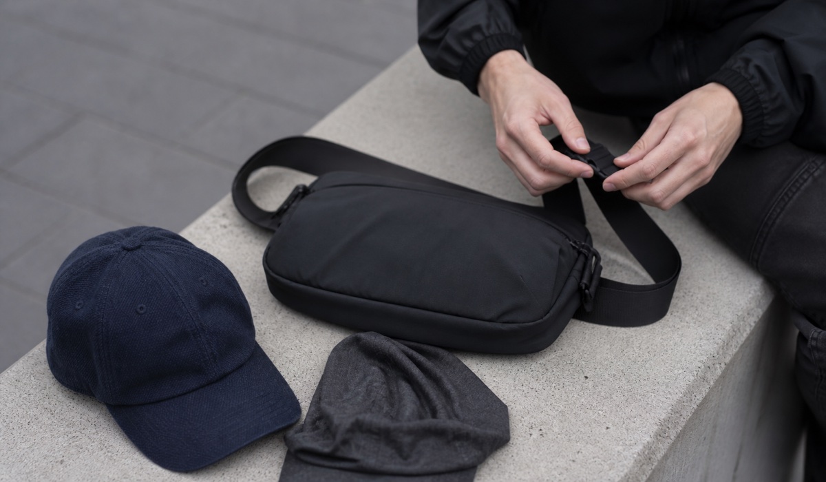 Streetwear details: nylon bag, buff and textured baseball cap